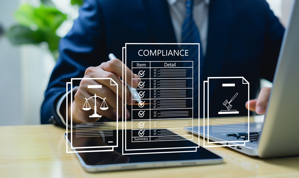Corporate compliance and certification concept, business manager reviewing law, standard, and government regulations for corporate approval, legal policy, and quality assurance.